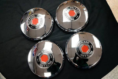 Set of (4) 1946-1950 Packard Hubcaps NEW OLD STOCK